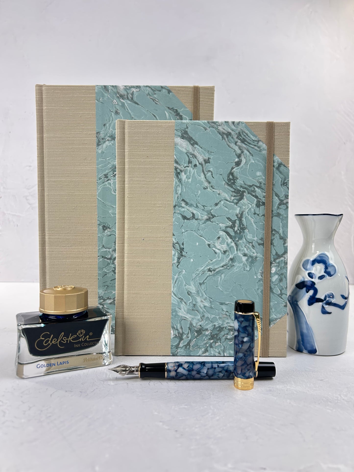 A5 160-page Hardcover Journal finished in Platinum Japanese book cloth and light blue French Marble Paper