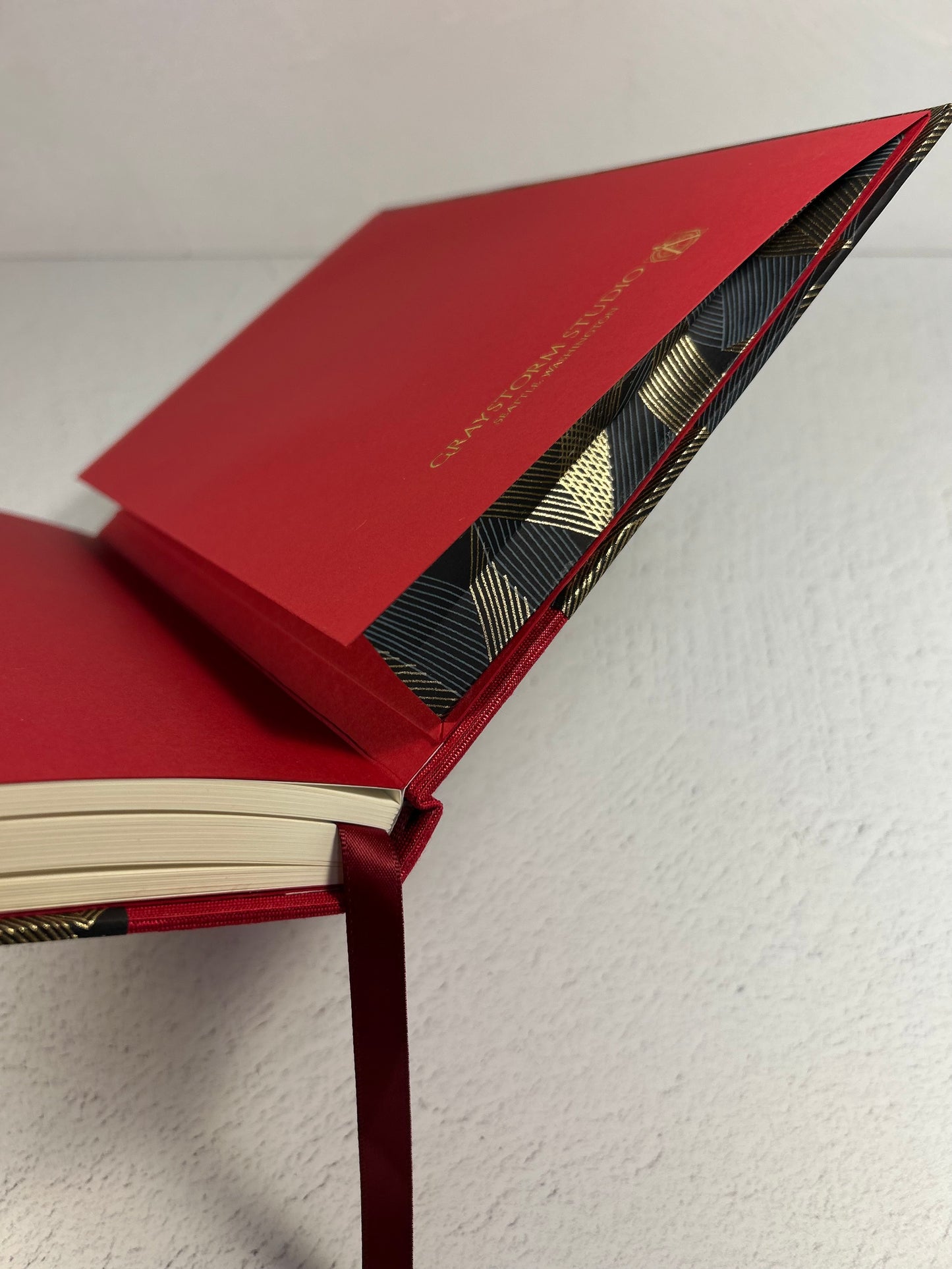 A5 160-page Hardcover Hardcover Notebook finished in Cardinal Red Japanese Bookcloth and Black and Gold Chiyogami Japanese Paper