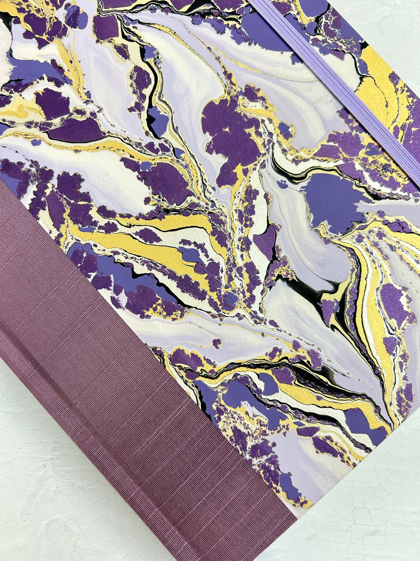 B5 192-page Hardcover Journal finished in plum Japanese book cloth and hand marbled paper by Renato Crepaldi