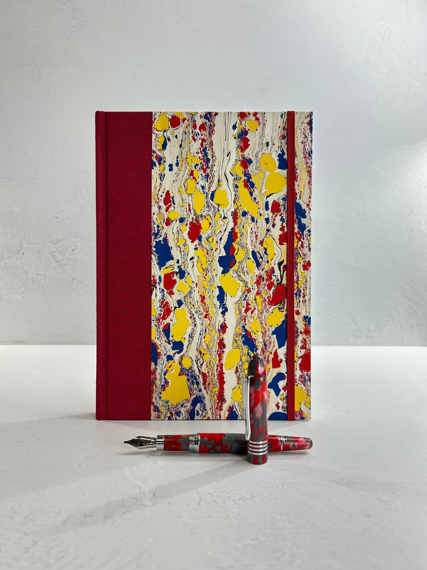 B5 192-page Hardcover Journal finished in Cardinal Red Japanese book cloth and Italian hand-marbled paper by Renato Crepaldi