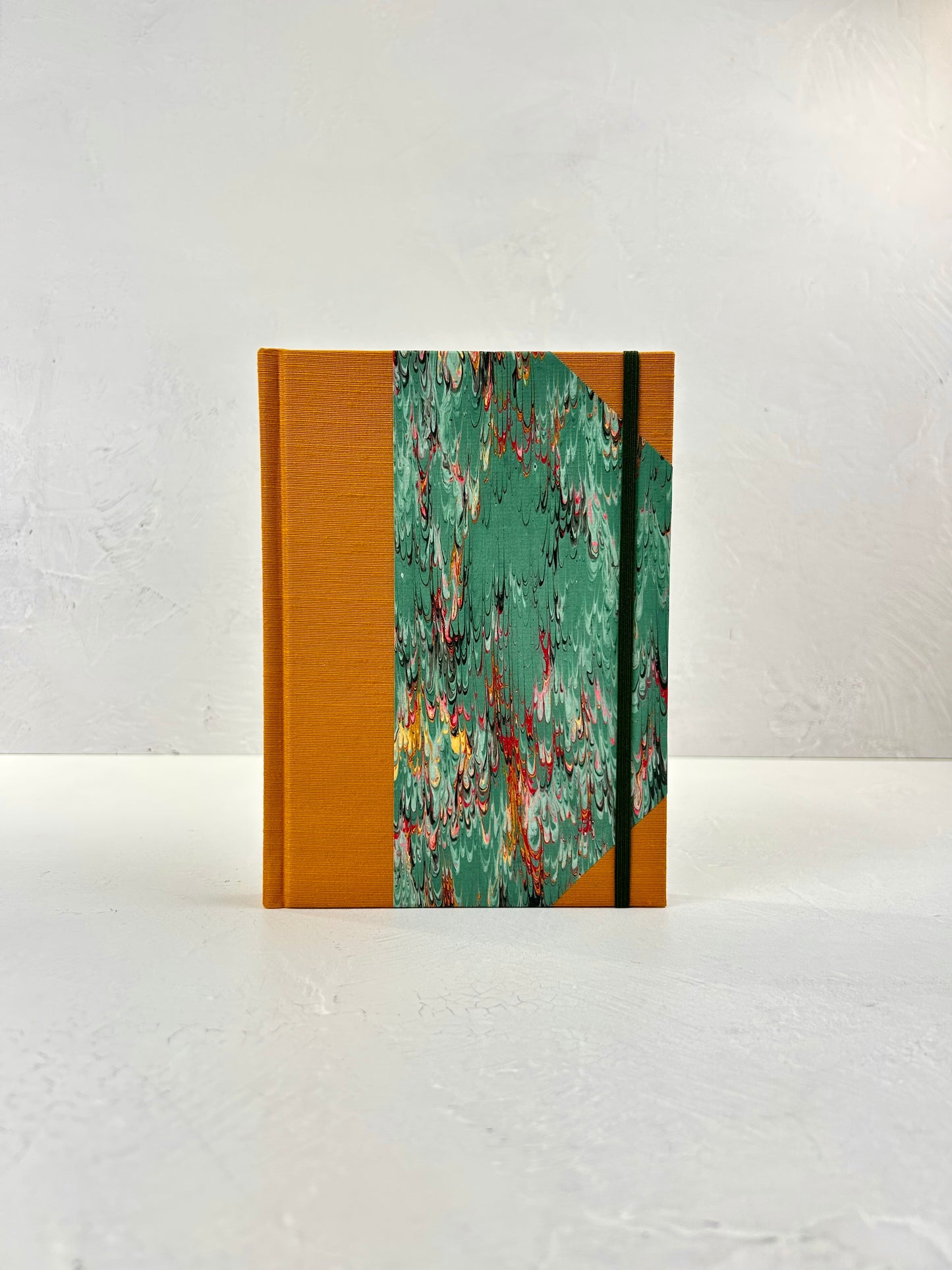 A5 160-page Hardcover Journal finished in Ochre Japanese book cloth and green French Marble Paper