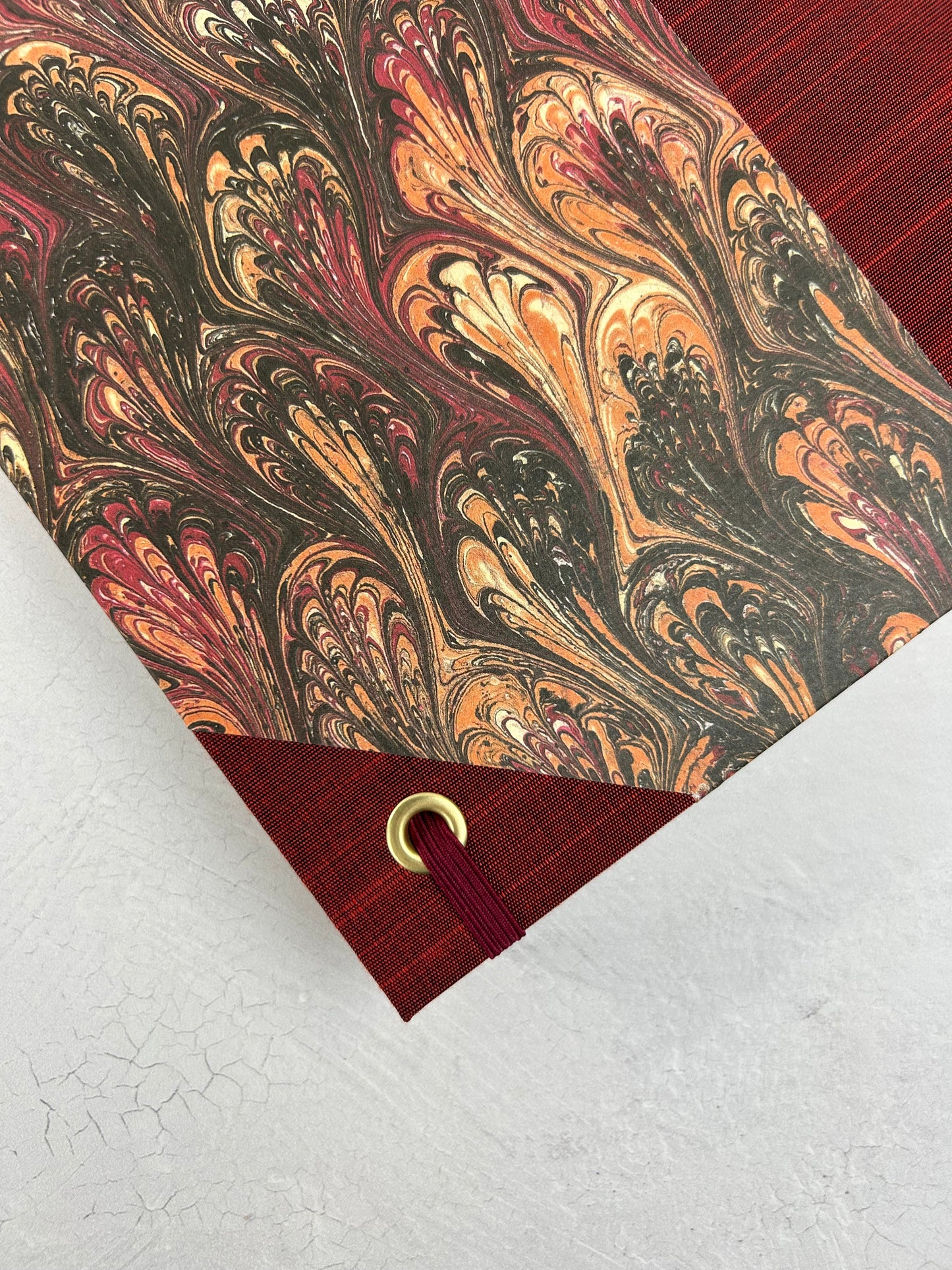 B5 192-page Hardcover Journal finished in Maroon Japanese book cloth and wine/black French Marbled Paper