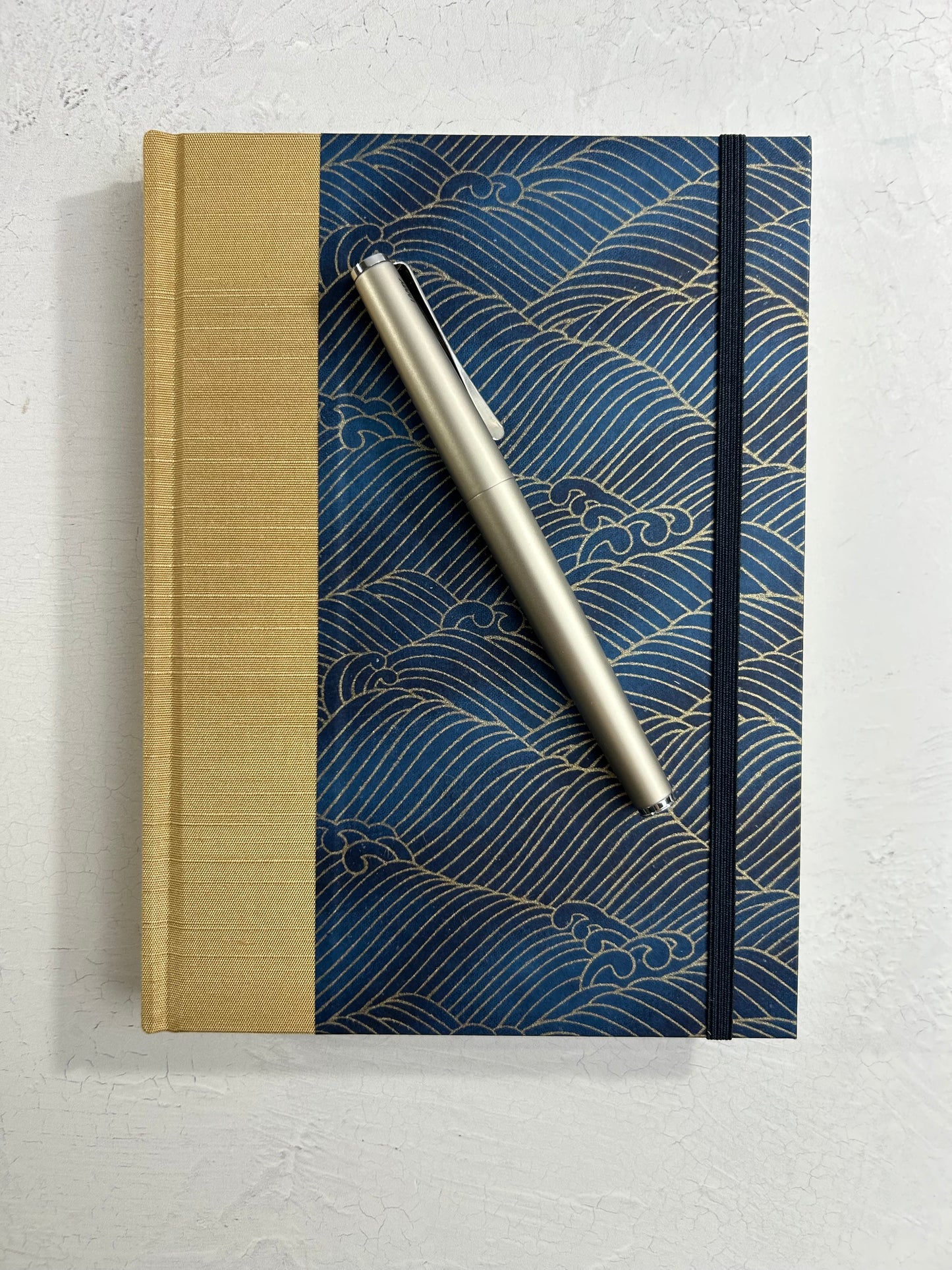 A5 160-page Hardcover Journal finished in soft gold Japanese book cloth and golden waves on blue Chiyogami Paper