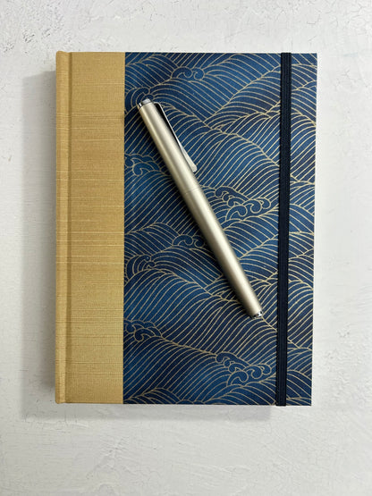 A5 160-page Hardcover Journal finished in soft gold Japanese book cloth and golden waves on blue Chiyogami Paper