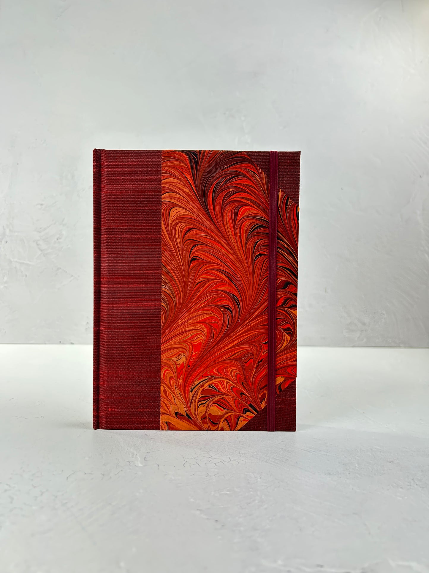 A5 160-page Hardcover Journal finished in Dark Red Japanese book cloth and hand marbled paper by Daniel Gaál