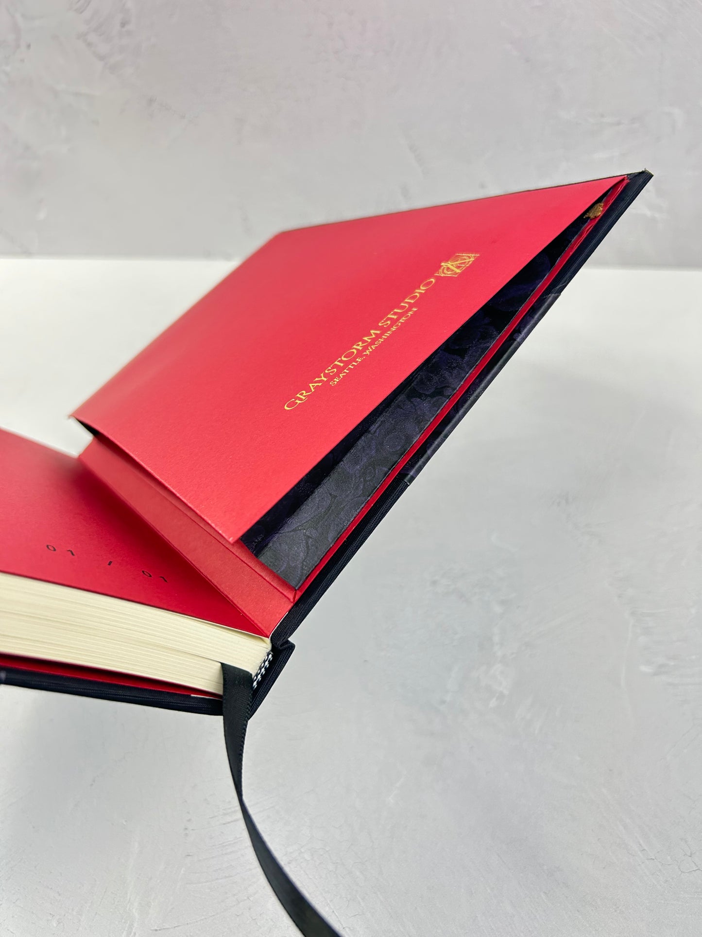 B5 192-page Hardcover Journal finished in Black Japanese book cloth and indigo hand marbled paper by Daniel Gaál