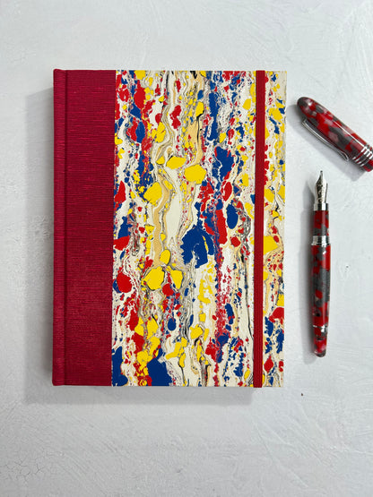 A5 160-page Hardcover Journal finished in Cardinal Red Japanese book cloth and Italian hand-marbled paper by Renato Crepaldi