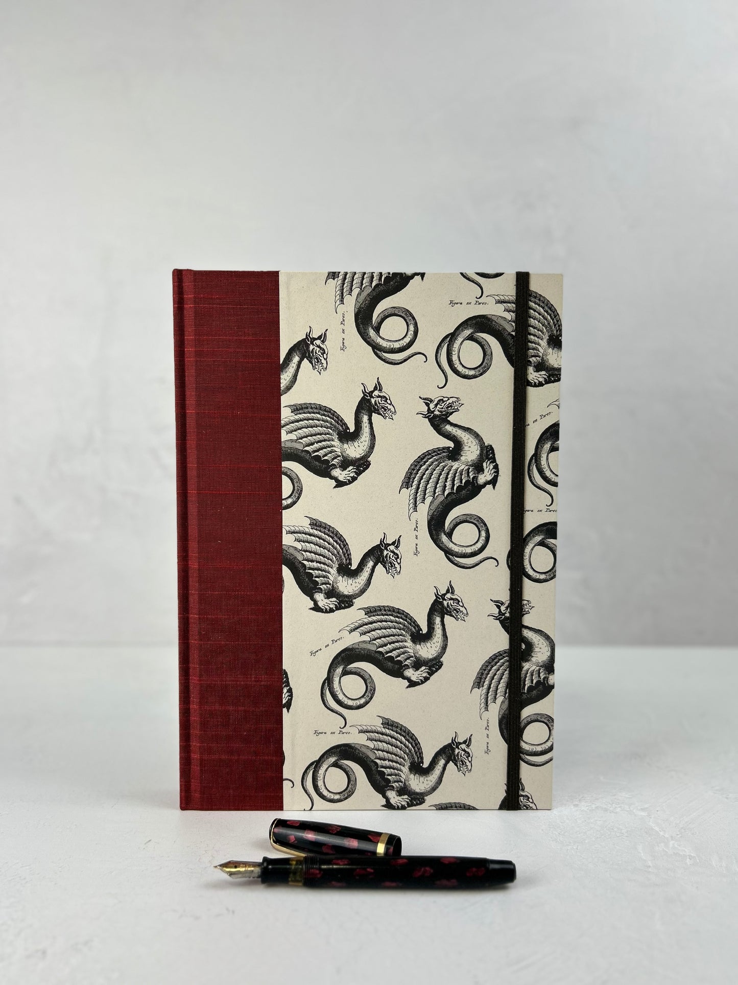 B5 Hardcover Notebook finished in Blood Red Japanese book cloth and Italian Medieval Letterpress Dragons Paper