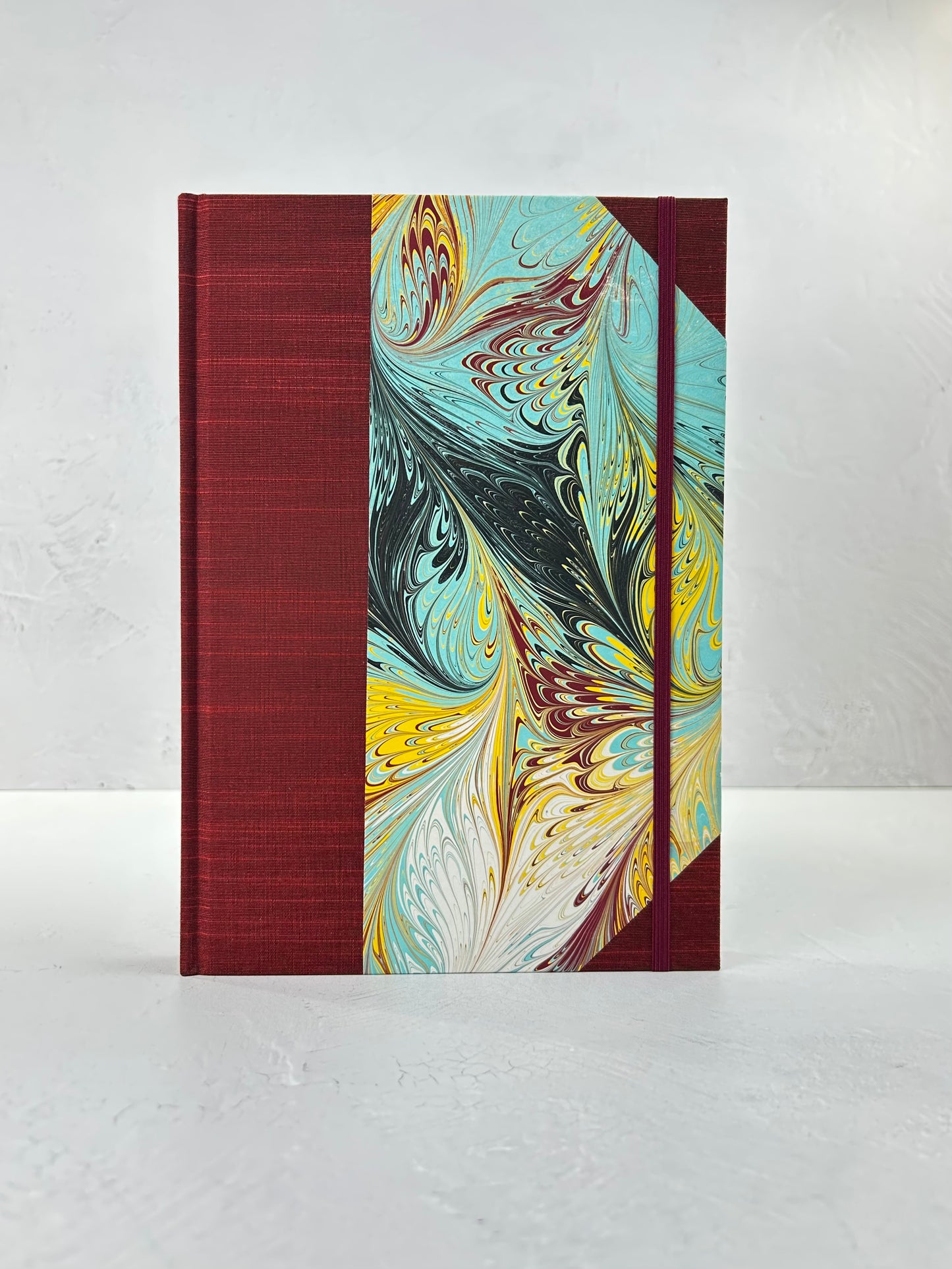 B5 192-page Hardcover Journal finished in Dark Red Japanese book cloth and hand marbled paper by Daniel Gaál