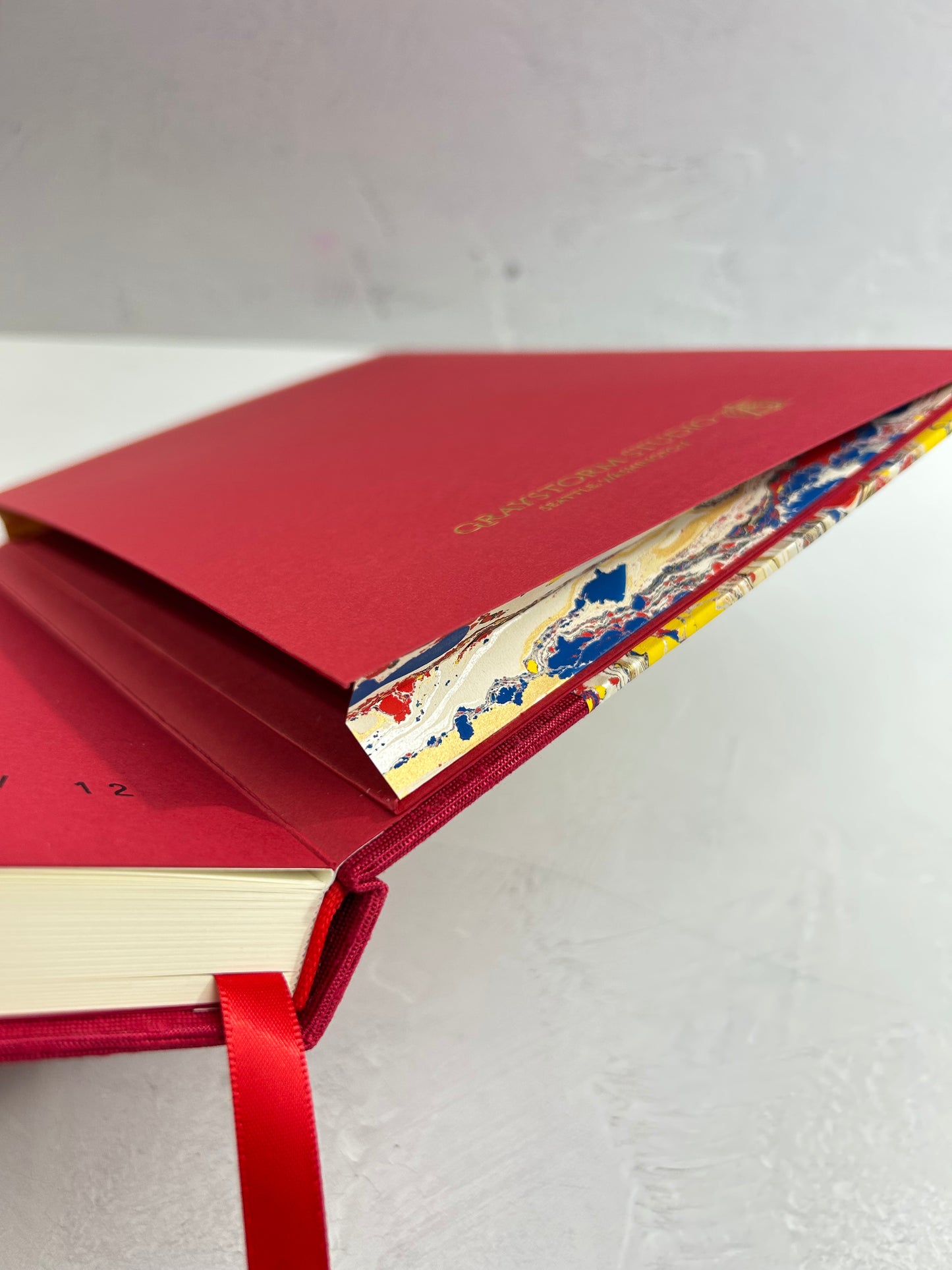 B5 192-page Hardcover Journal finished in Cardinal Red Japanese book cloth and Italian hand-marbled paper by Renato Crepaldi