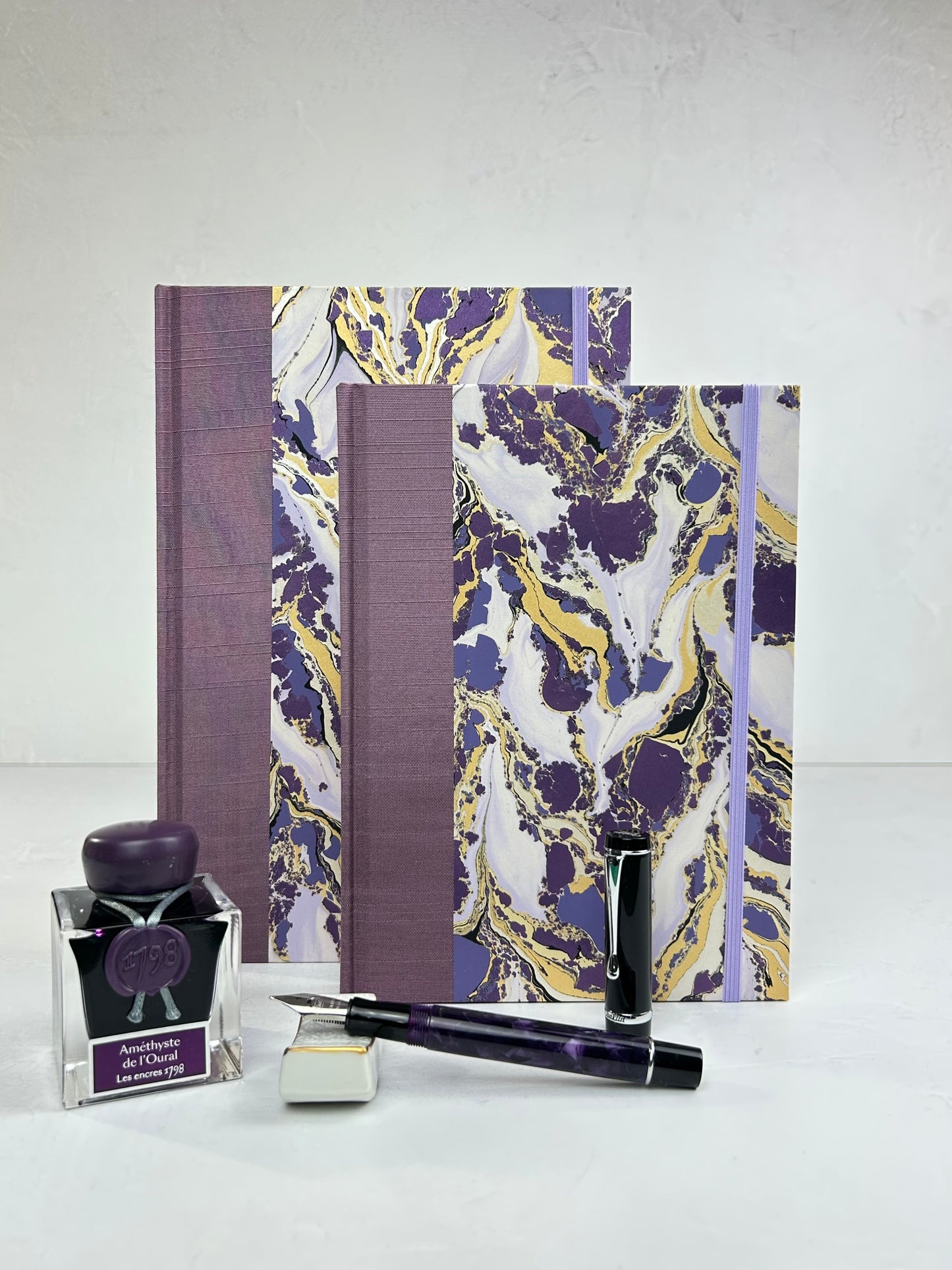 B5 192-page Hardcover Journal finished in plum Japanese book cloth and hand marbled paper by Renato Crepaldi
