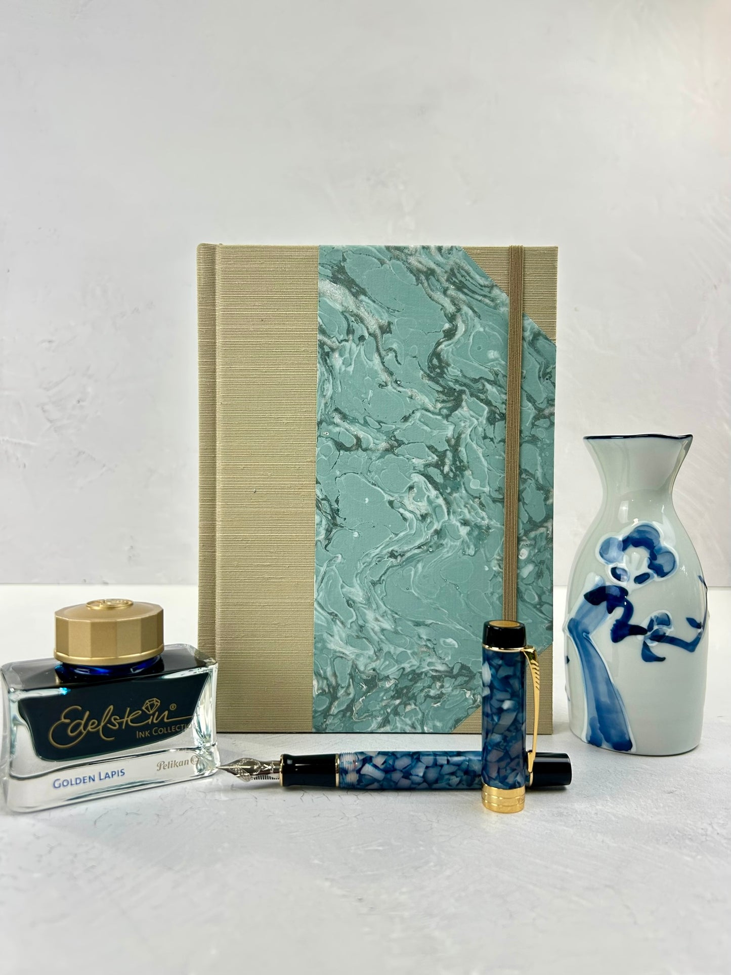 A5 160-page Hardcover Journal finished in Platinum Japanese book cloth and light blue French Marble Paper