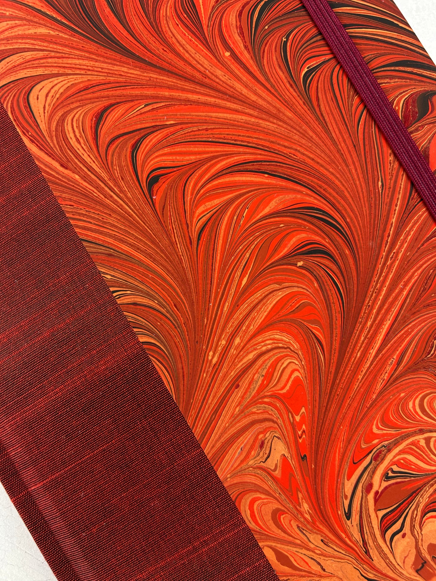 A5 160-page Hardcover Journal finished in Dark Red Japanese book cloth and hand marbled paper by Daniel Gaál