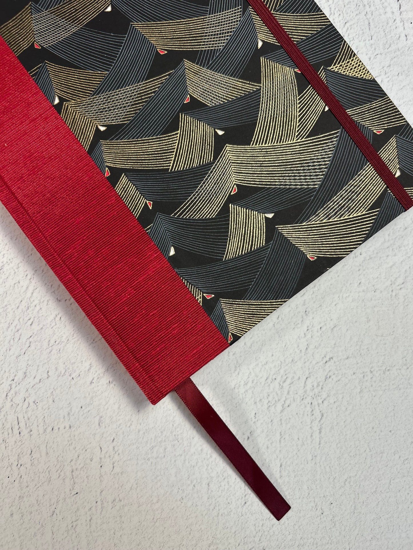 A5 160-page Hardcover Hardcover Notebook finished in Cardinal Red Japanese Bookcloth and Black and Gold Chiyogami Japanese Paper
