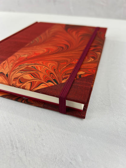 A5 160-page Hardcover Journal finished in Dark Red Japanese book cloth and hand marbled paper by Daniel Gaál