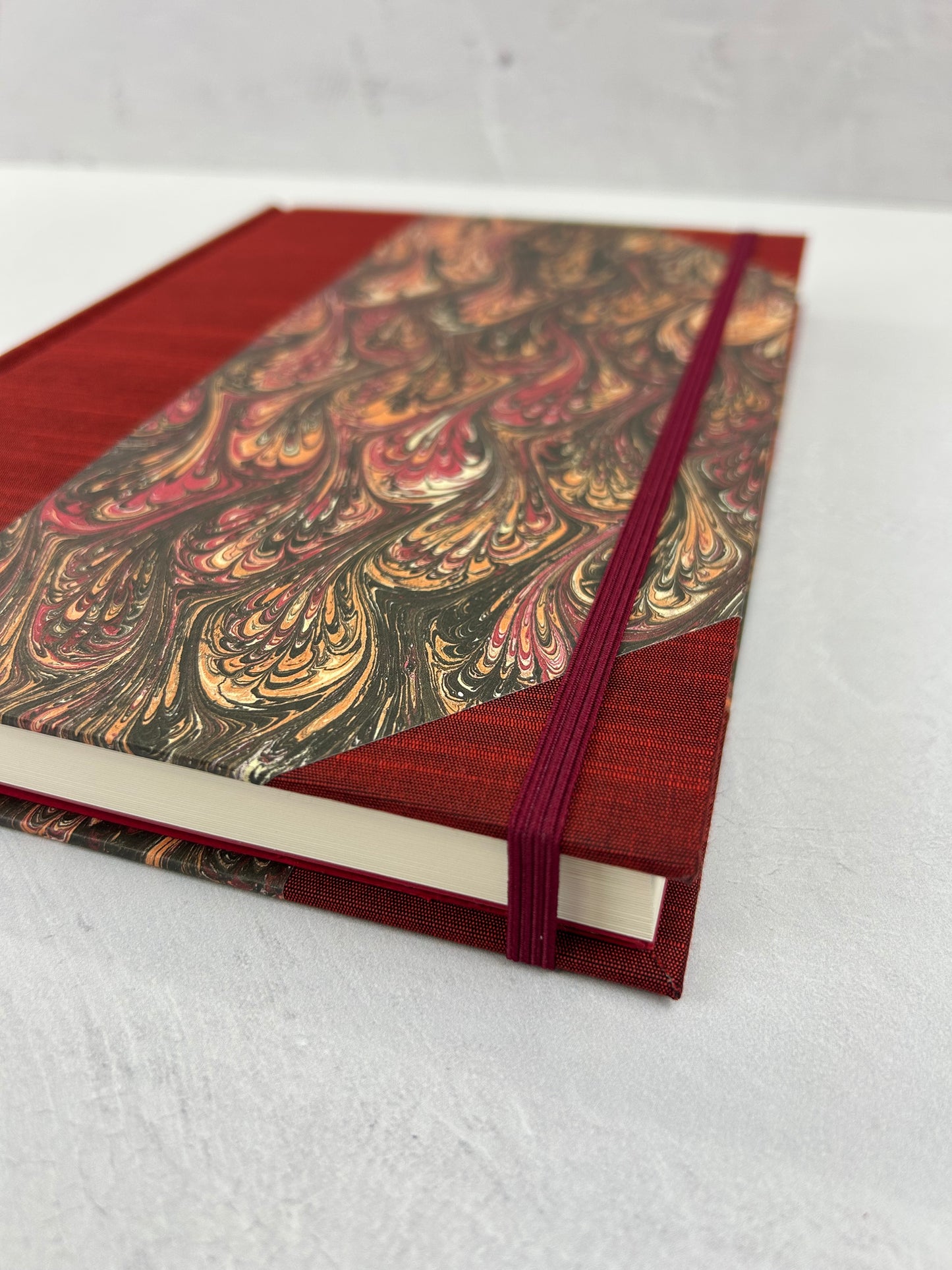 B5 192-page Hardcover Journal finished in Maroon Japanese book cloth and wine/black French Marbled Paper