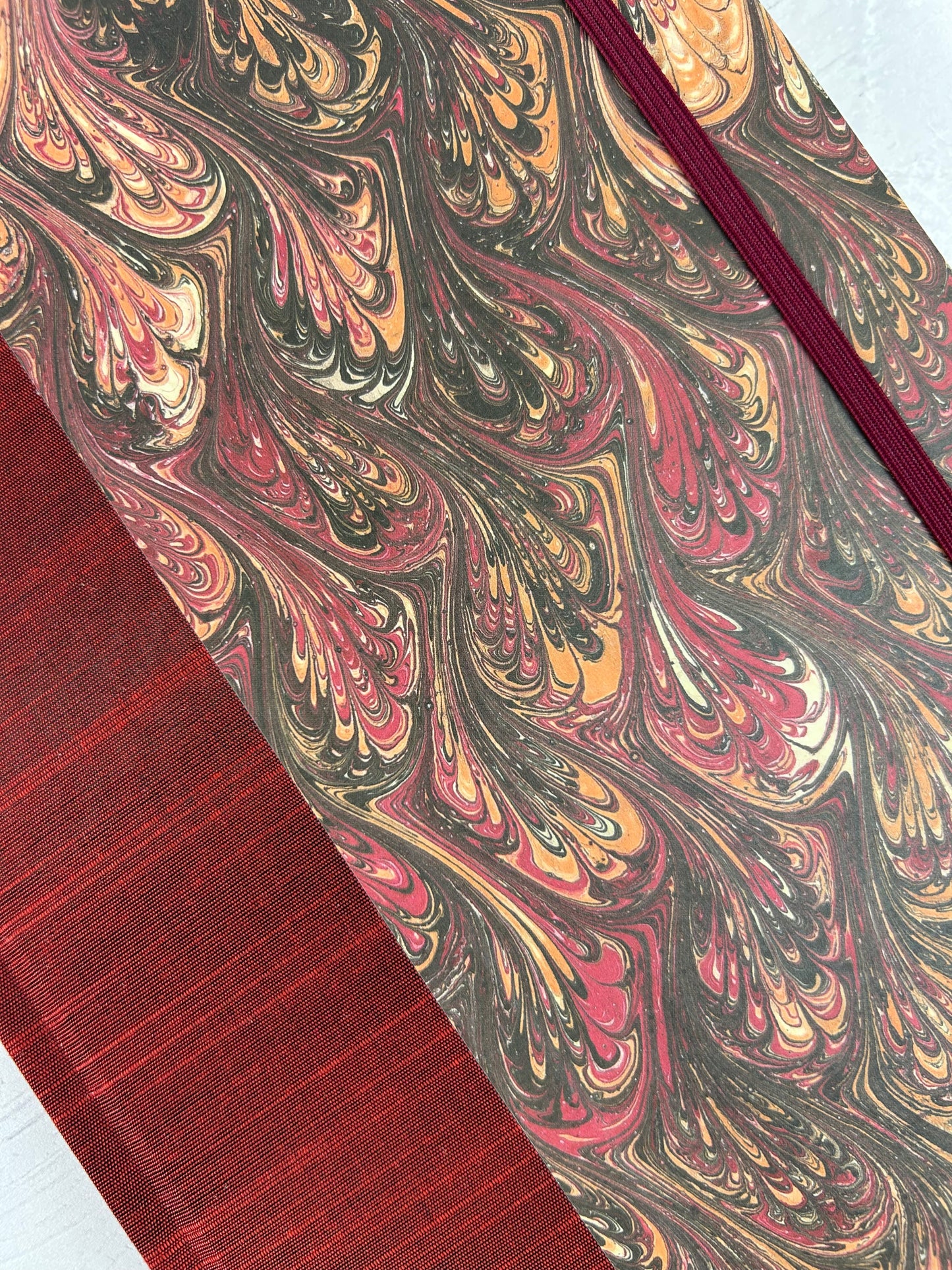 B5 192-page Hardcover Journal finished in Maroon Japanese book cloth and wine/black French Marbled Paper