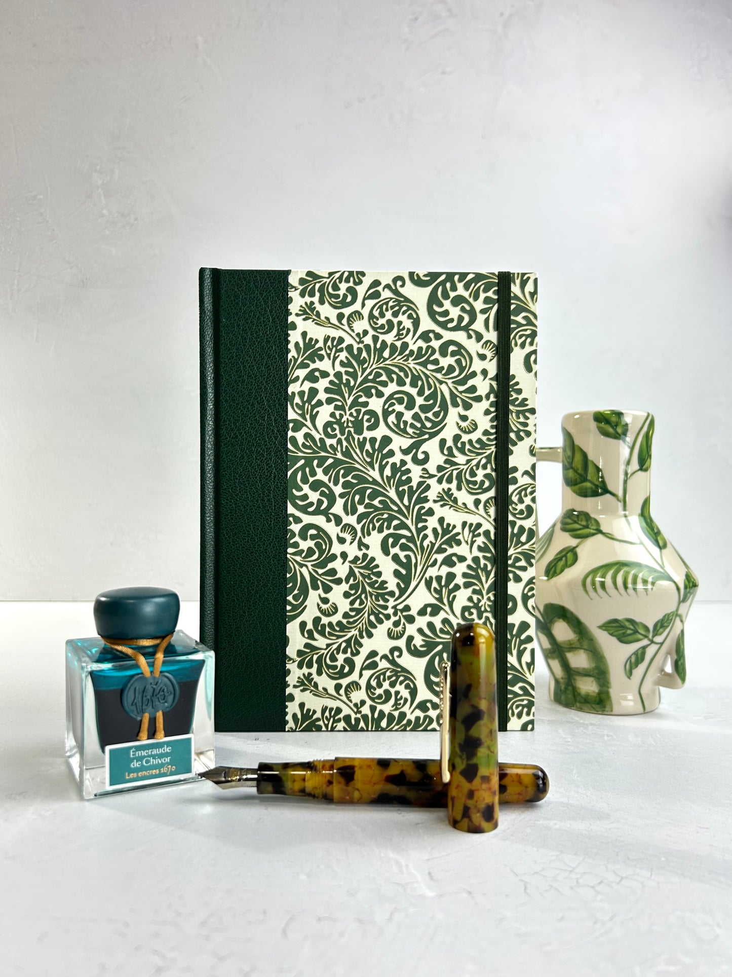 A5 160-page Hardcover Journal finished in Green Vaux Leather and green and gold fern Italian Florentine print