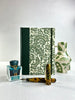 A5 160-page Hardcover Journal finished in Green Vaux Leather and green and gold fern Italian Florentine print