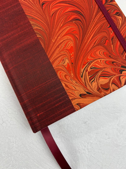 A5 160-page Hardcover Journal finished in Dark Red Japanese book cloth and hand marbled paper by Daniel Gaál