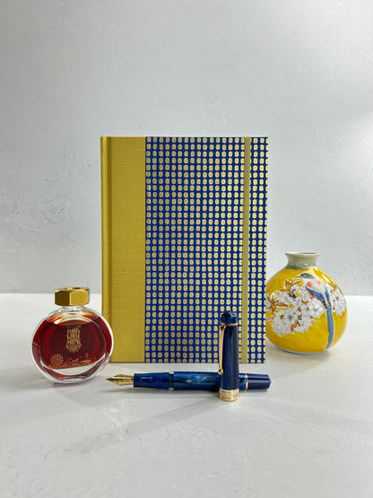 A5 160-page Hardcover Journal finished in Yellow Gold Japanese book cloth and blue and gold Chiyogami Paper