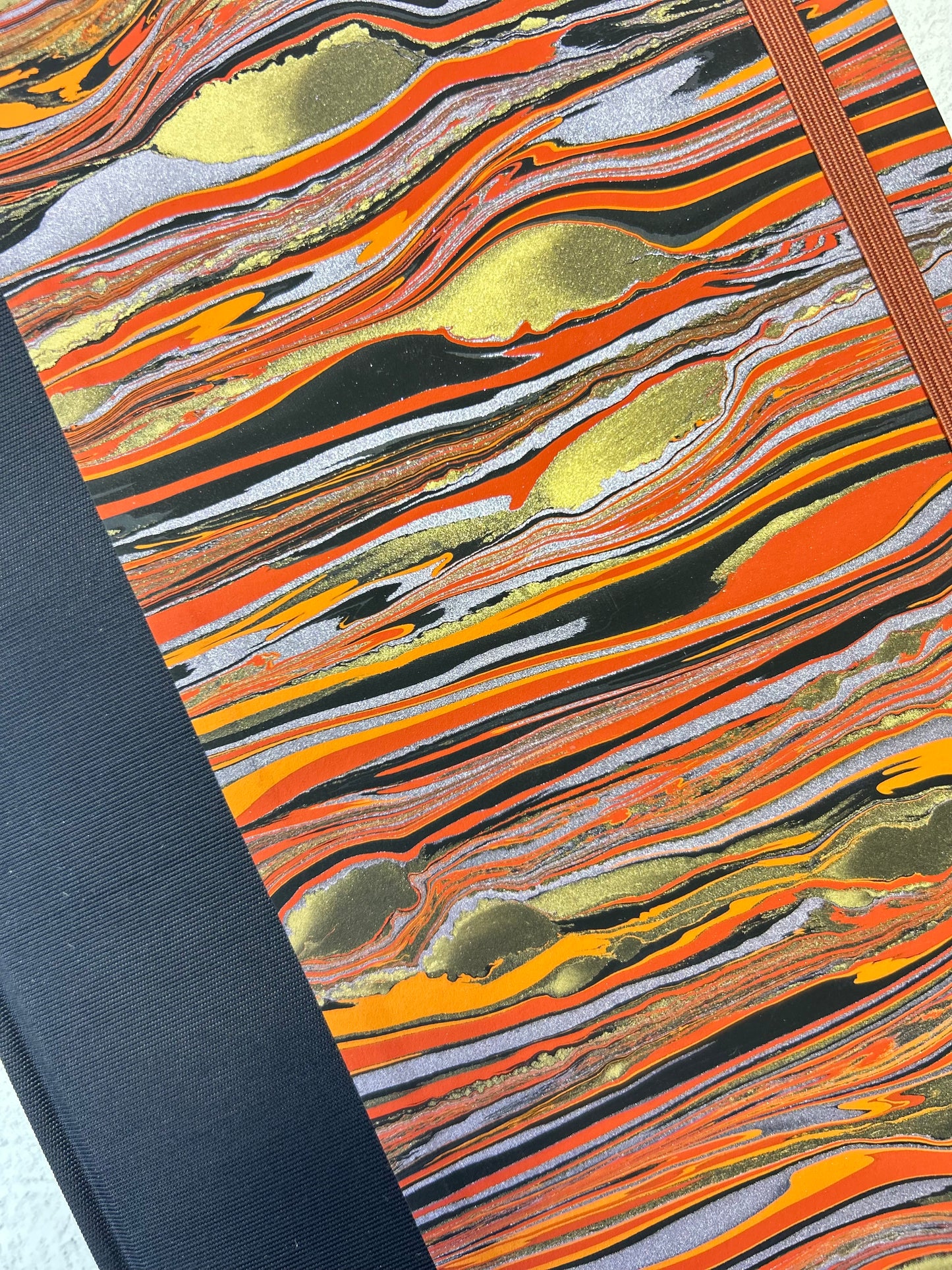 A5 Hardcover Notebook finished in Black Japanese book cloth and Renato Crepaldi hand marbled paper