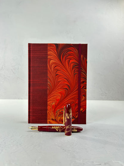 A5 160-page Hardcover Journal finished in Dark Red Japanese book cloth and hand marbled paper by Daniel Gaál