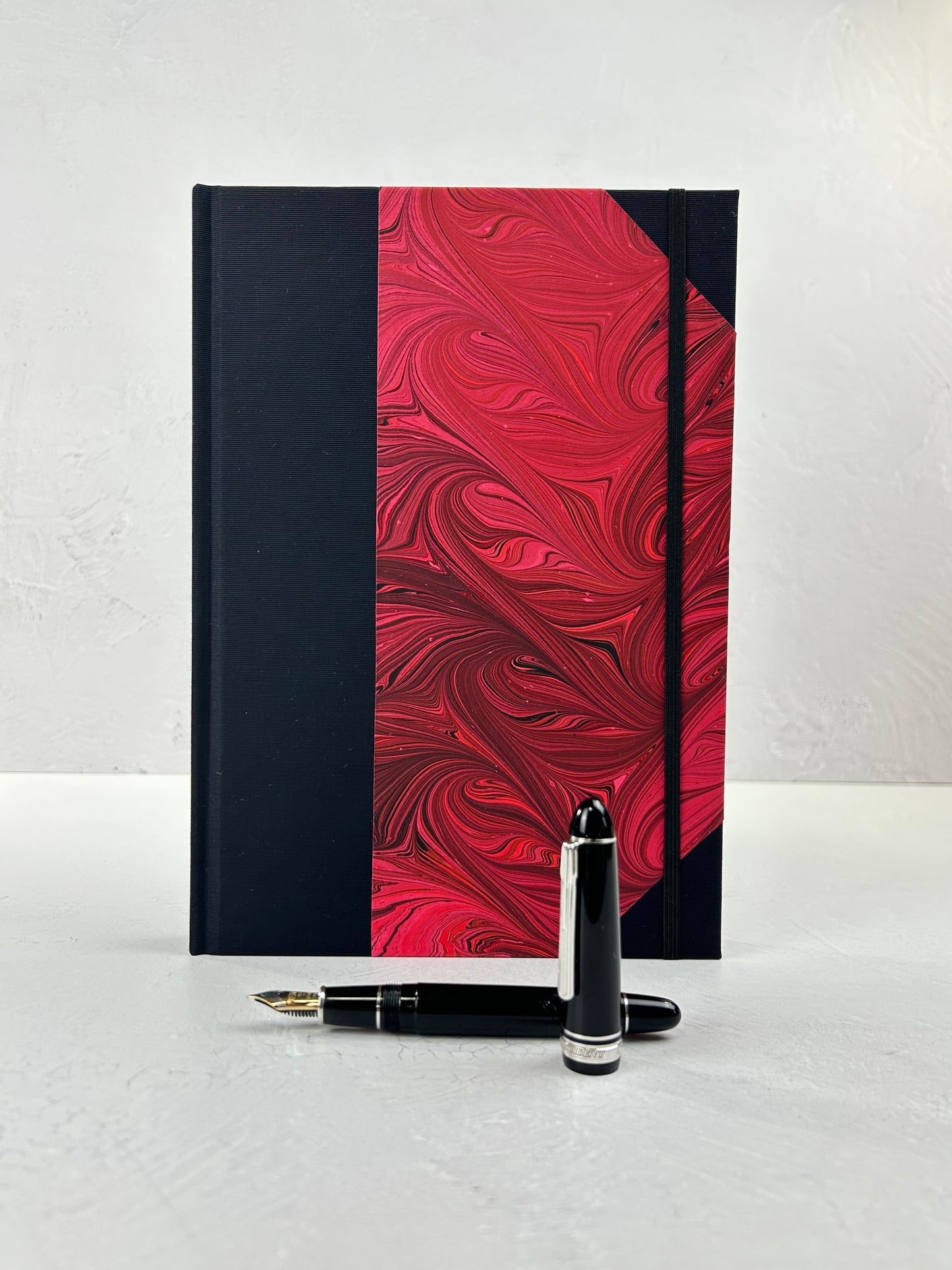 B5 192-page Hardcover Journal finished in Black Japanese book cloth and red hand marbled paper by Daniel Gaál