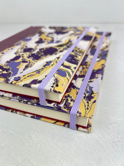 B5 192-page Hardcover Journal finished in plum Japanese book cloth and hand marbled paper by Renato Crepaldi