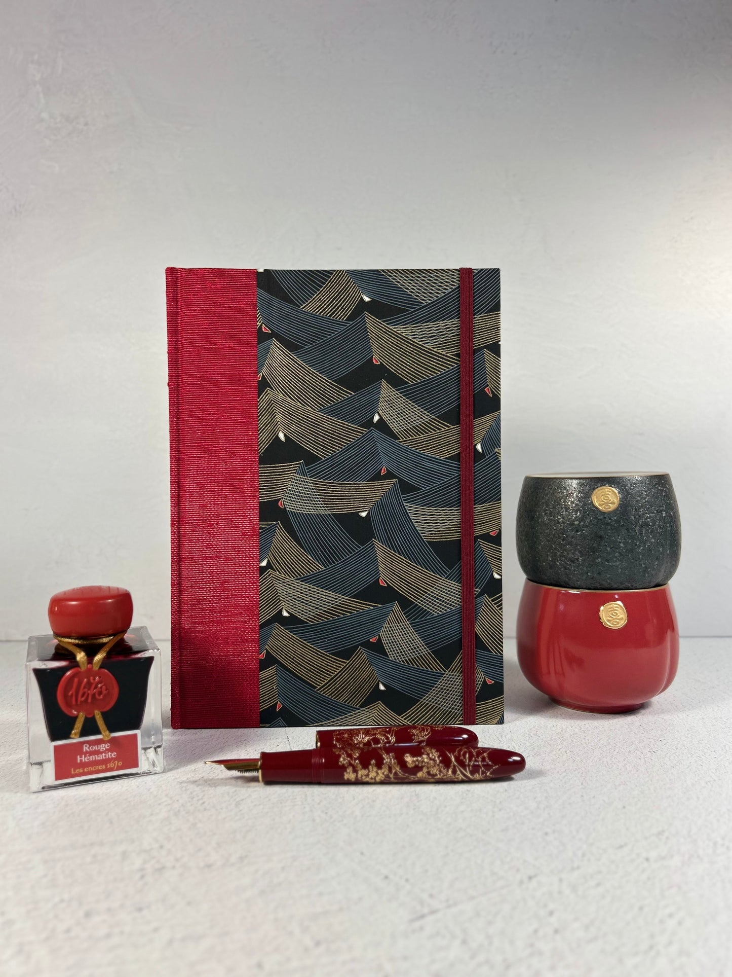 A5 160-page Hardcover Hardcover Notebook finished in Cardinal Red Japanese Bookcloth and Black and Gold Chiyogami Japanese Paper