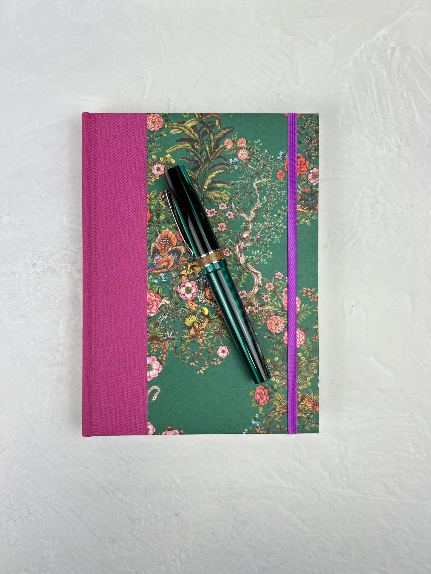 A5 160-page Hardcover Journal finished in in Berry Bloom Verona book cloth and Oasis Print by Phannapast Taychamaythakool