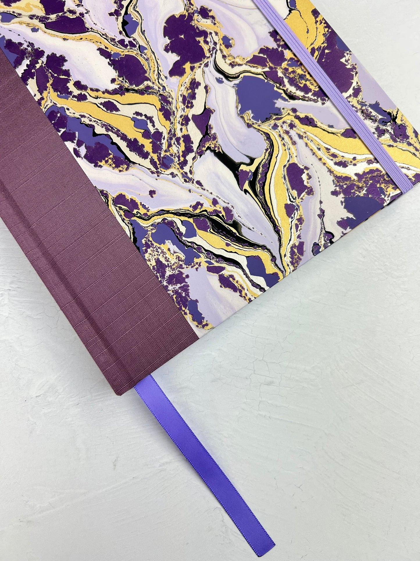 B5 192-page Hardcover Journal finished in plum Japanese book cloth and hand marbled paper by Renato Crepaldi