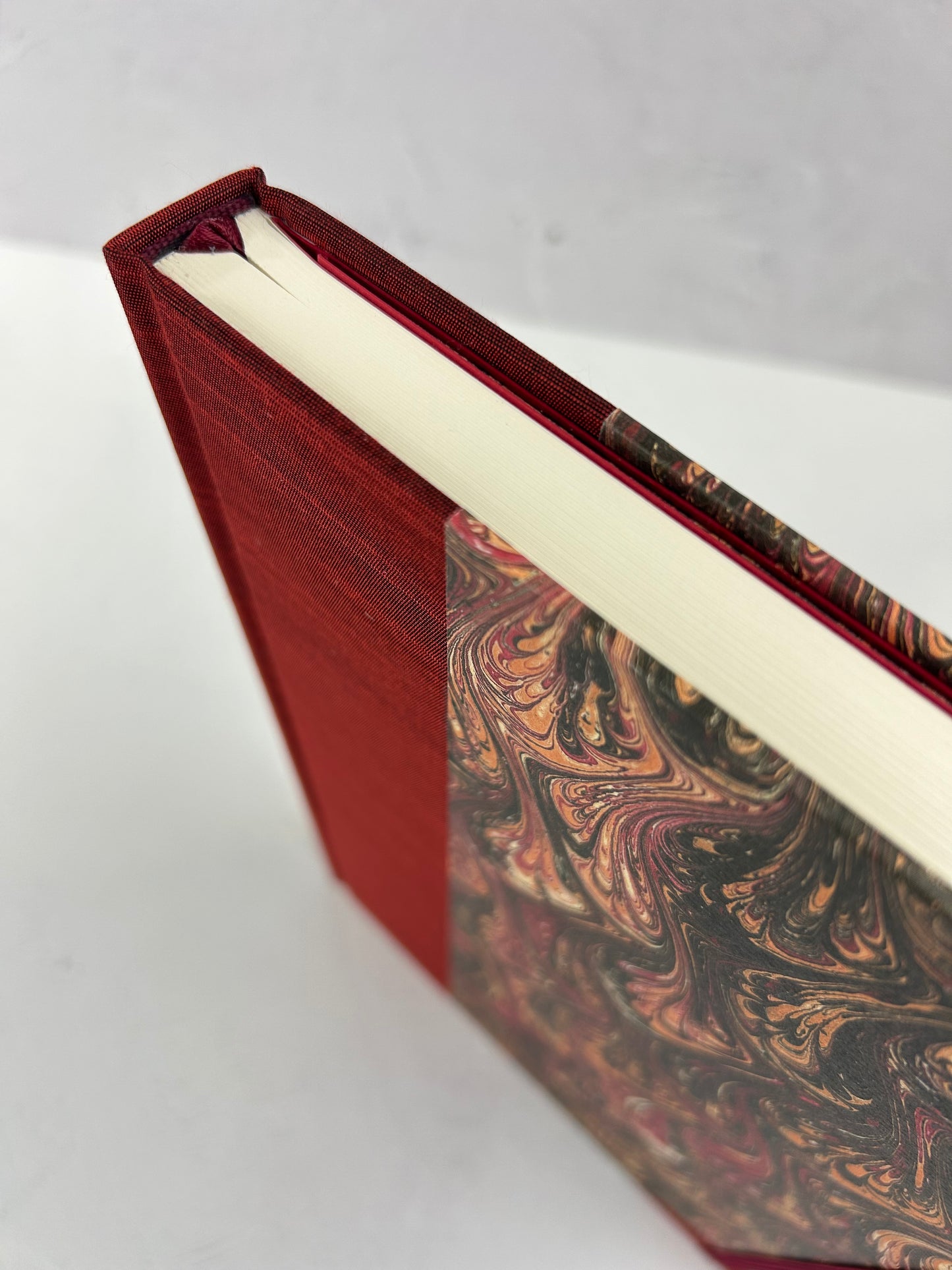 B5 192-page Hardcover Journal finished in Maroon Japanese book cloth and wine/black French Marbled Paper