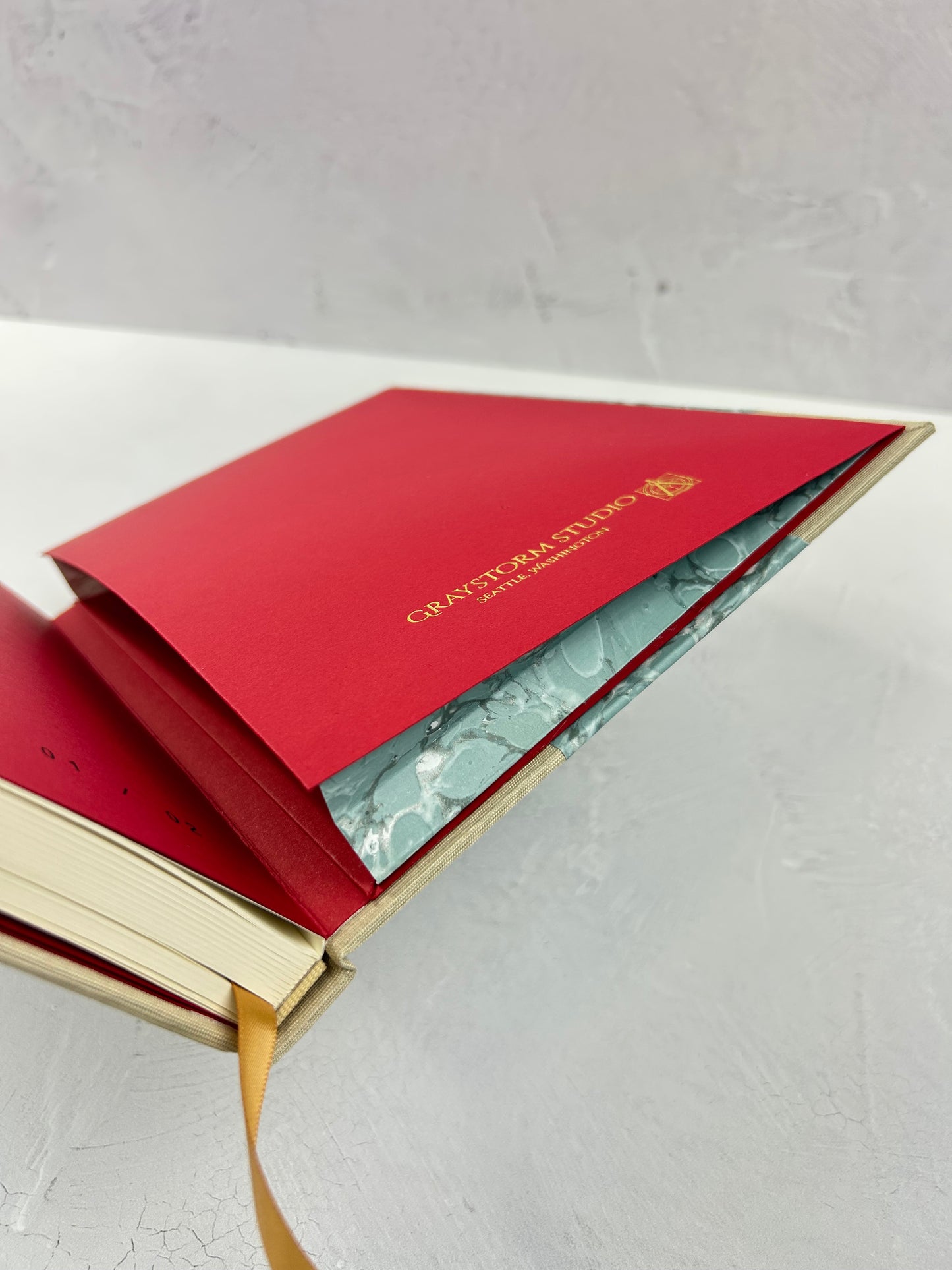 A5 160-page Hardcover Journal finished in Platinum Japanese book cloth and light blue French Marble Paper