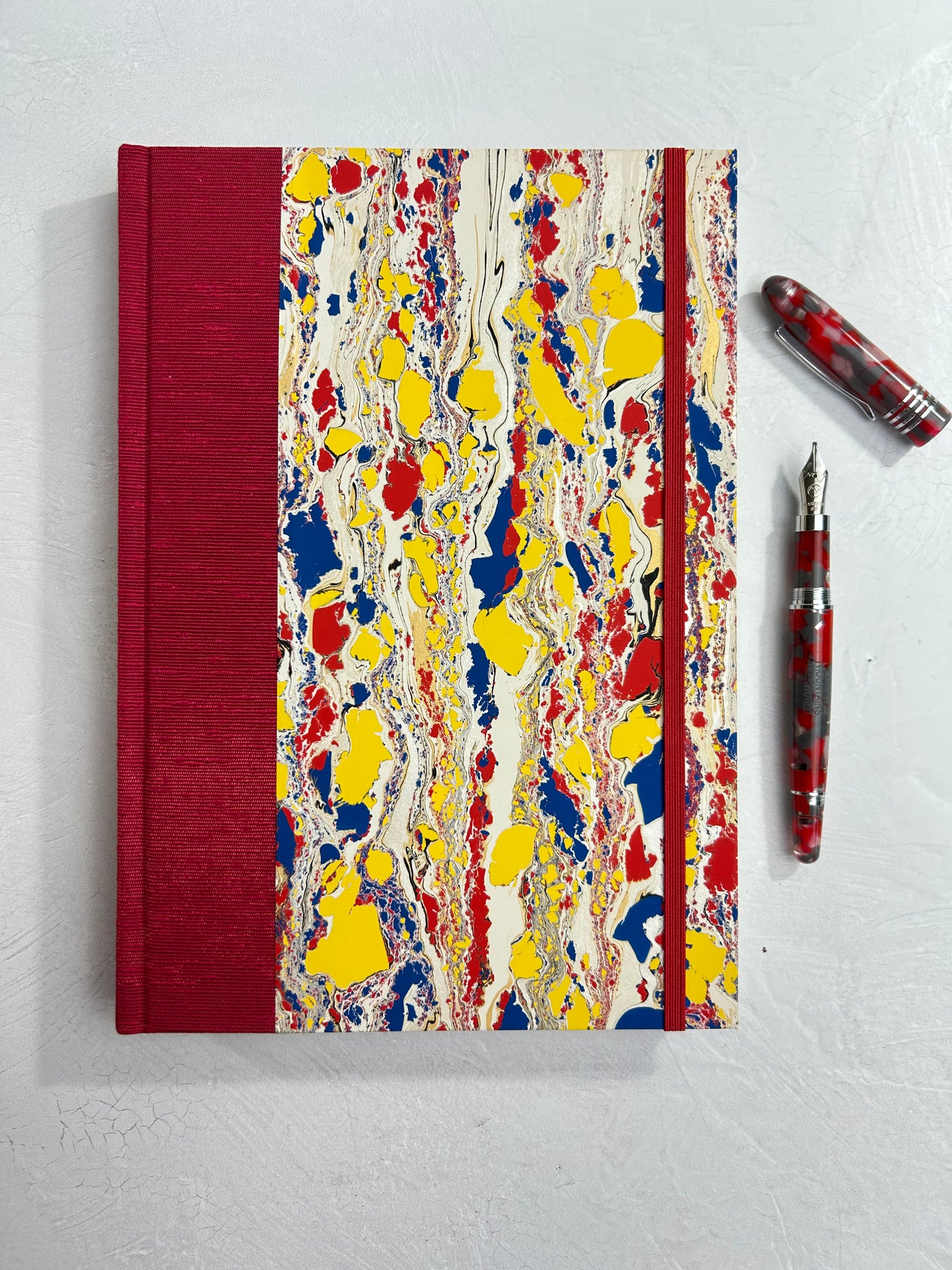 B5 192-page Hardcover Journal finished in Cardinal Red Japanese book cloth and Italian hand-marbled paper by Renato Crepaldi