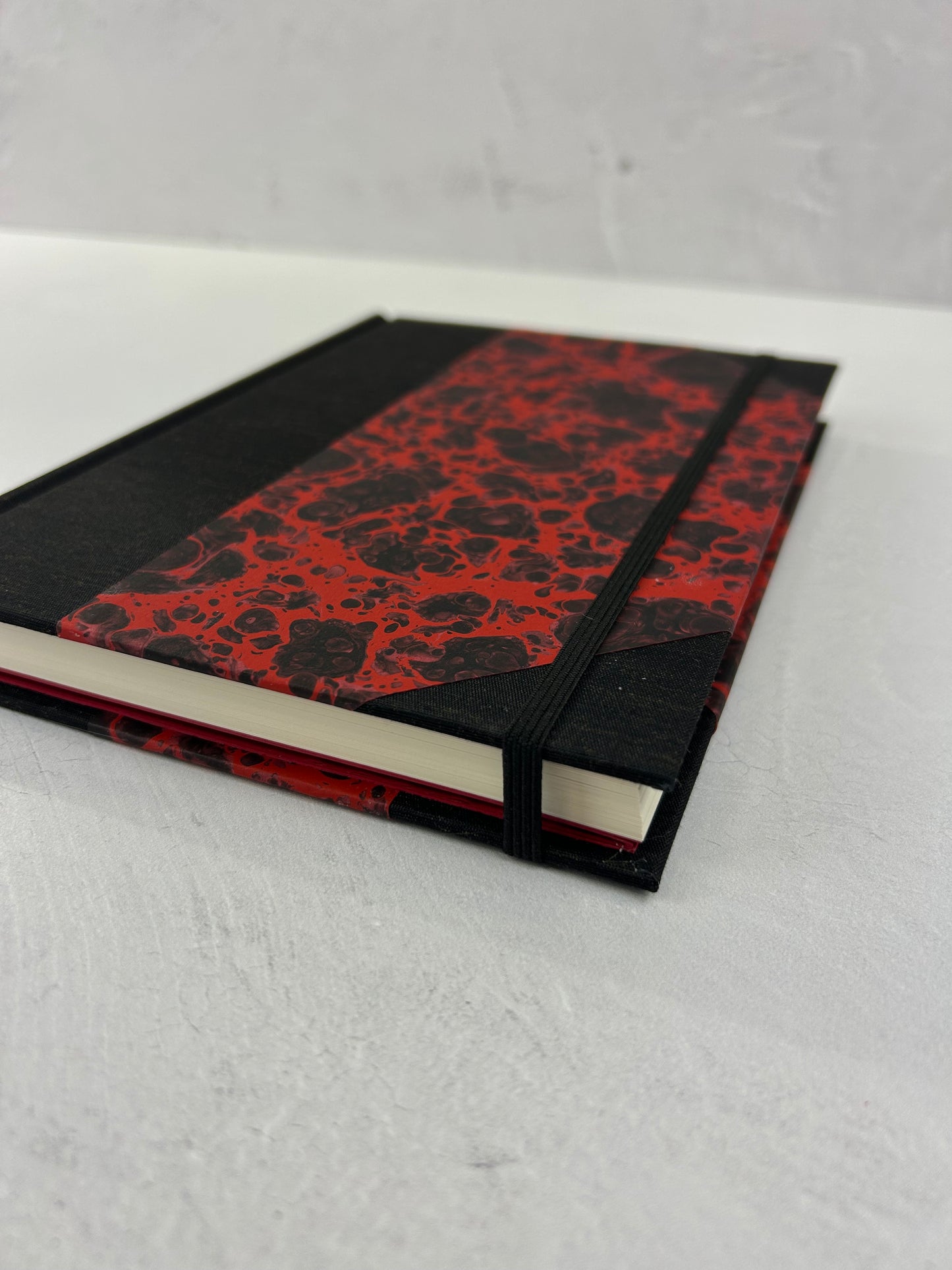 A5 160-page Hardcover Journal finished in Black Mohair Japanese book cloth and hand marbled paper by Daniel Gaál
