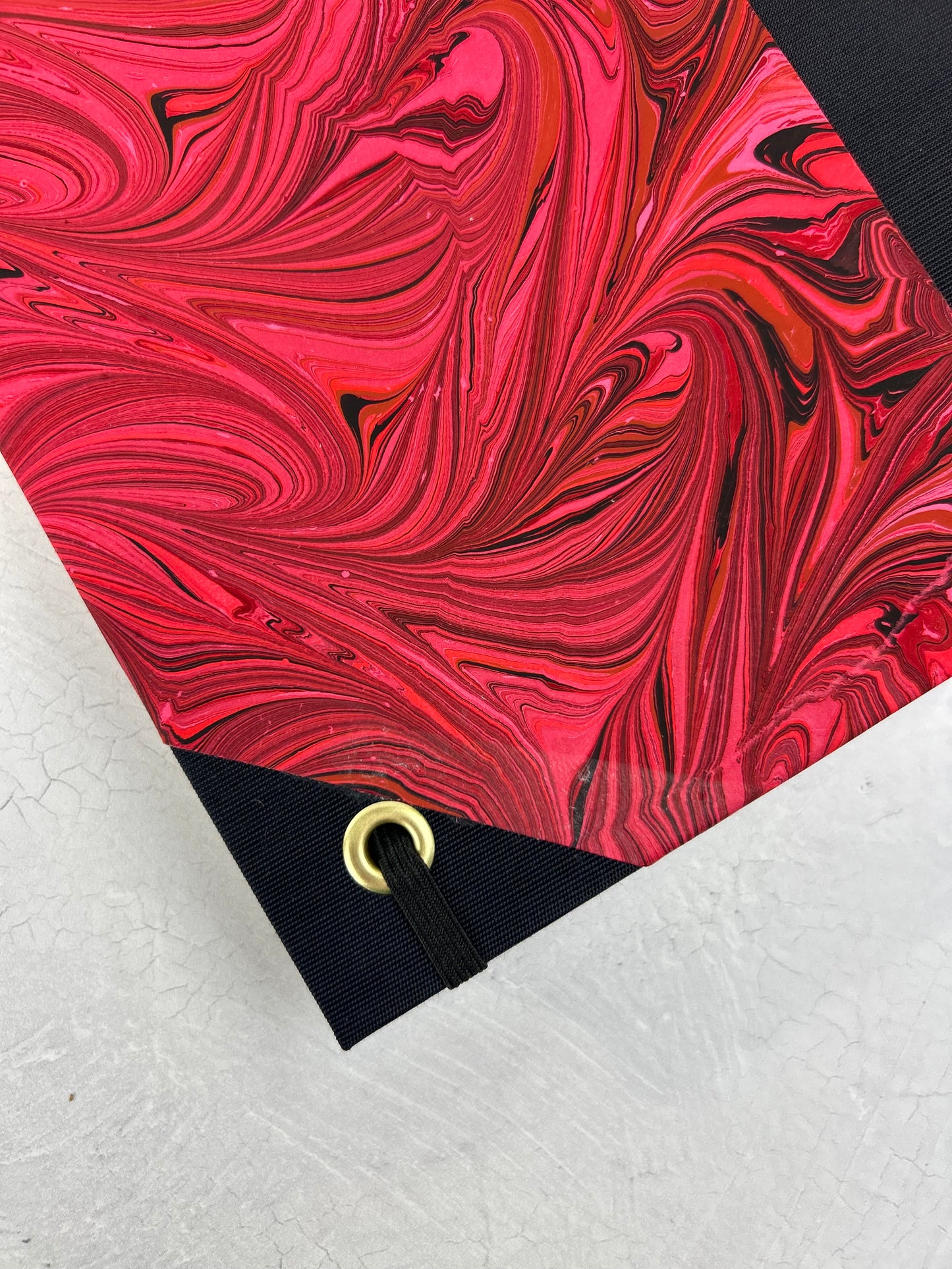 B5 192-page Hardcover Journal finished in Black Japanese book cloth and red hand marbled paper by Daniel Gaál