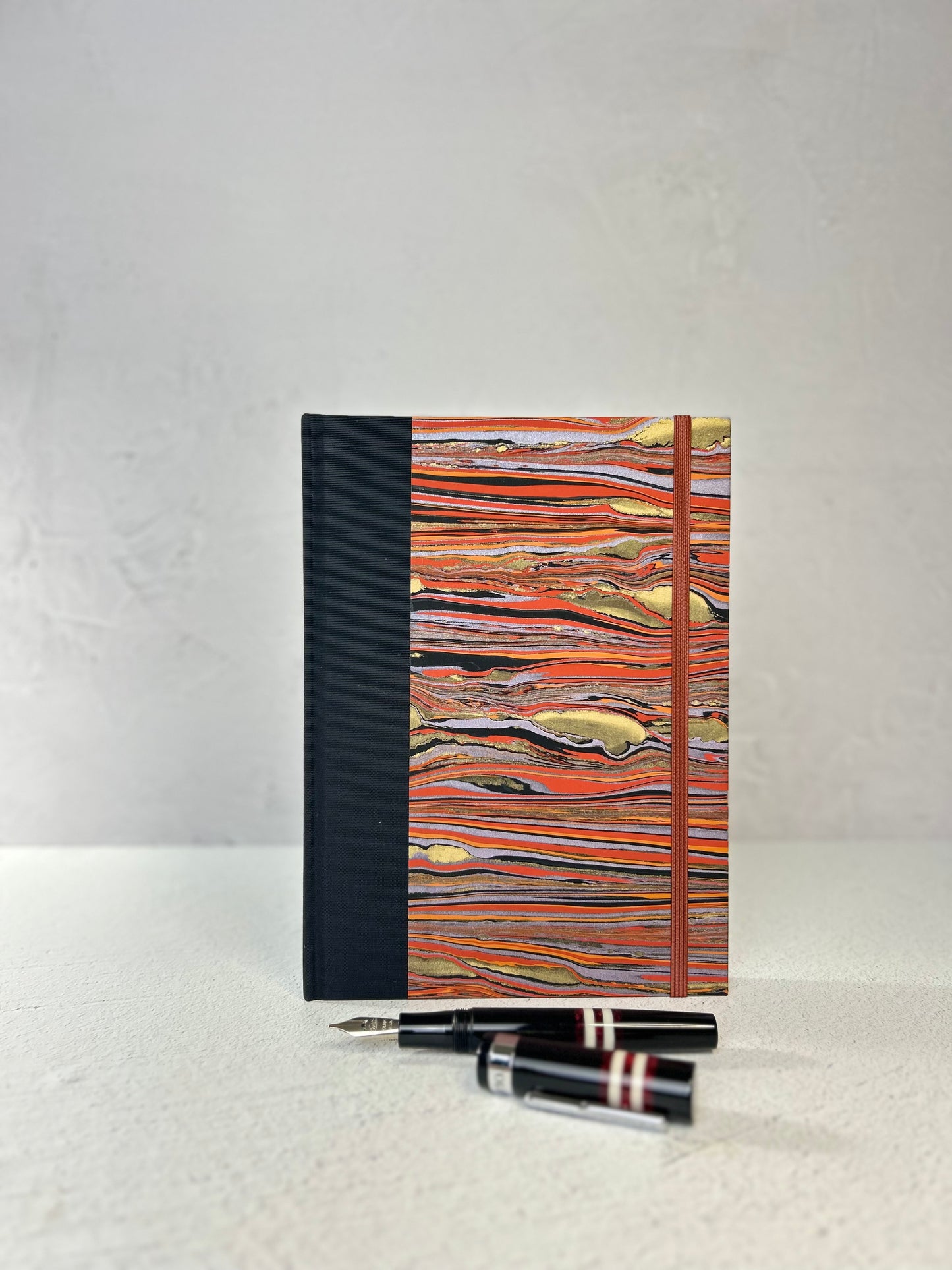 A5 Hardcover Notebook finished in Black Japanese book cloth and Renato Crepaldi hand marbled paper
