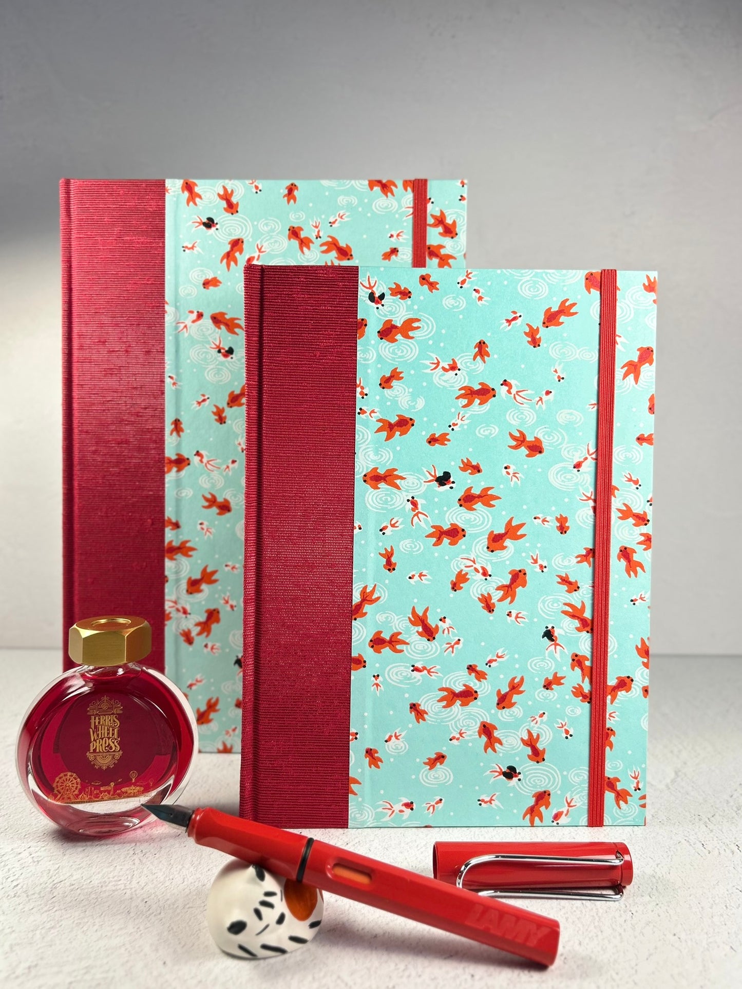 A5 Hardcover Notebook finished in Scarlet Red Japanese Bookcloth and Red/Orange Koi Fish on Aqua Chiyogami Paper