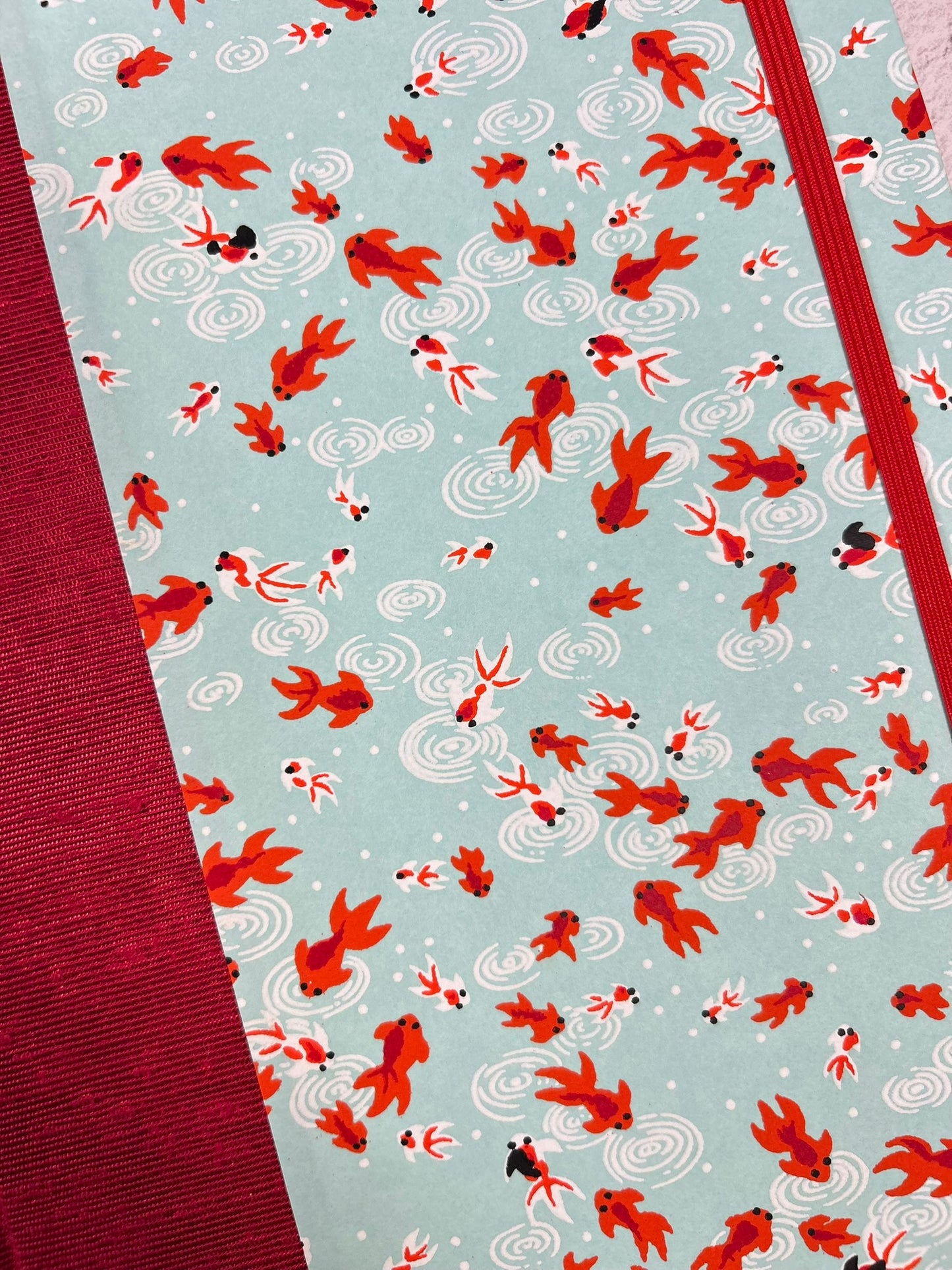 A5 Hardcover Notebook finished in Scarlet Red Japanese Bookcloth and Red/Orange Koi Fish on Aqua Chiyogami Paper