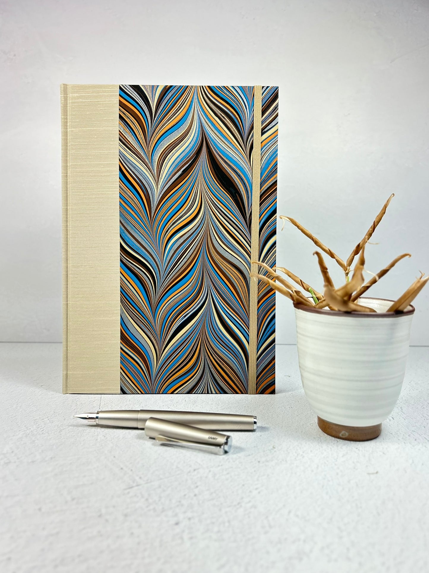 B5 Hardcover Notebook finished in Platinum Japanese book cloth and featuring Renato Crepaldi hand-marbled decorative paper