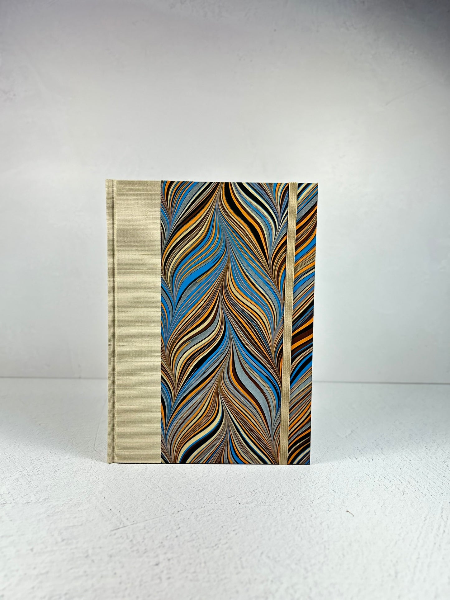 A5 Hardcover Notebook finished in Platinum Japanese book cloth and featuring Renato Crepaldi hand-marbled decorative paper