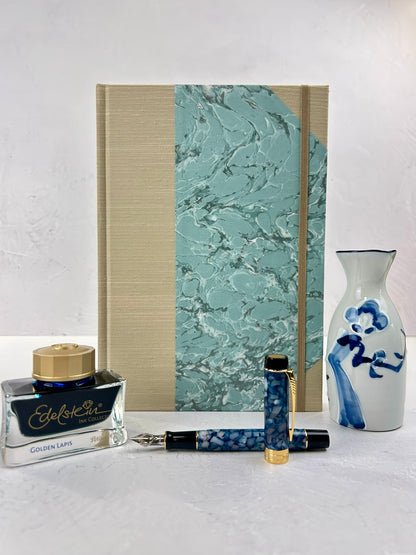 B5 192-page Hardcover Journal in finished in Platinum Japanese book cloth and light blue French Marble Paper