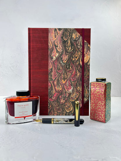 B5 192-page Hardcover Journal finished in Maroon Japanese book cloth and wine/black French Marbled Paper