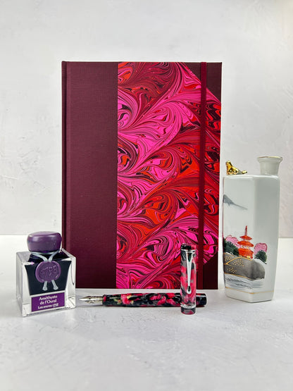 B5 192-page Hardcover Journal finished in Maroon Japanese book cloth and red/pink hand marbled paper by Daniel Gaál