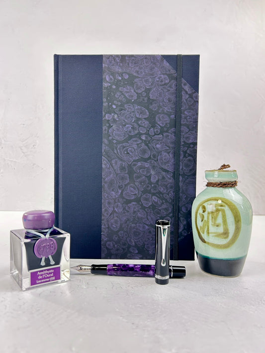 B5 192-page Hardcover Journal finished in Black Japanese book cloth and indigo hand marbled paper by Daniel Gaál