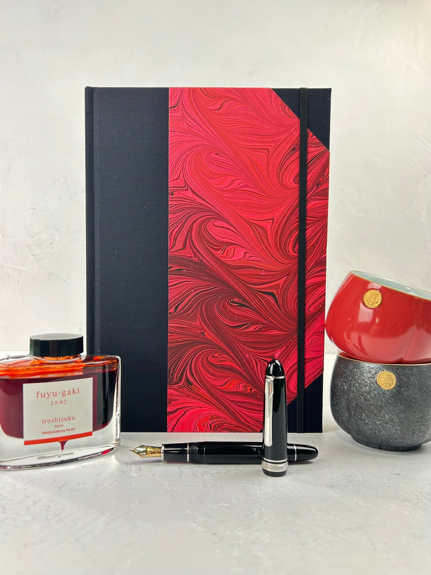 B5 192-page Hardcover Journal finished in Black Japanese book cloth and red hand marbled paper by Daniel Gaál