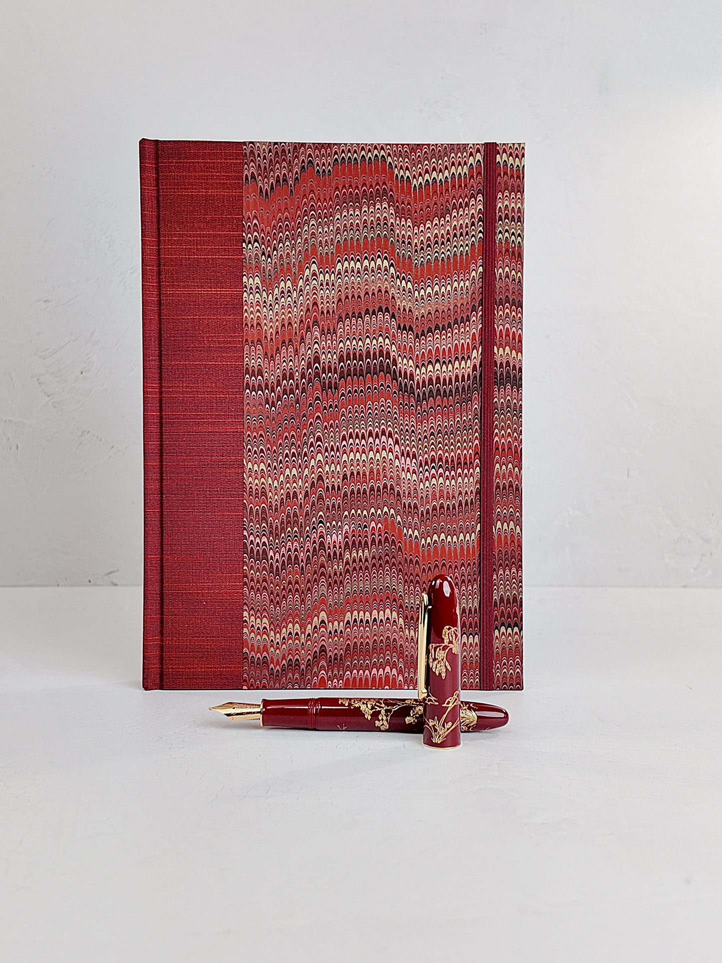 B5 192-page Hardcover Journal finished in Blood Red Japanese book cloth and Renato Crepaldi hand marbled paper