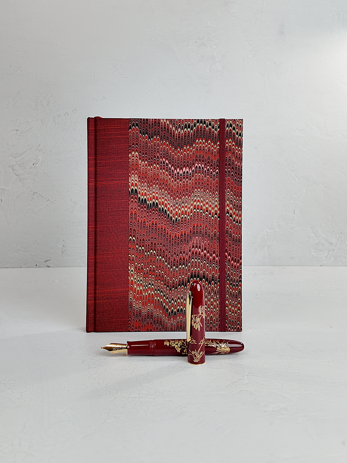 A5 160-page Hardcover Journal finished in Blood Red Japanese book cloth and Renato Crepaldi hand marbled paper