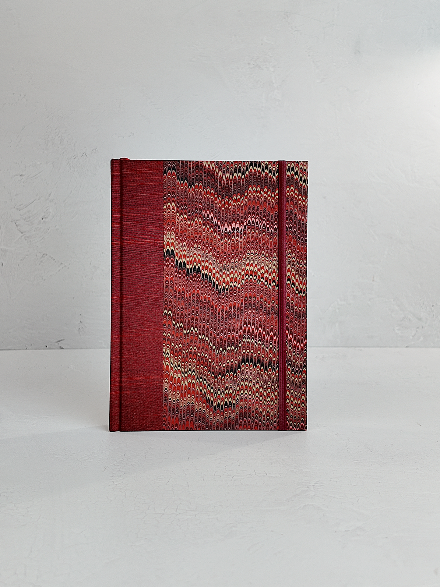 A5 160-page Hardcover Journal finished in Blood Red Japanese book cloth and Renato Crepaldi hand marbled paper